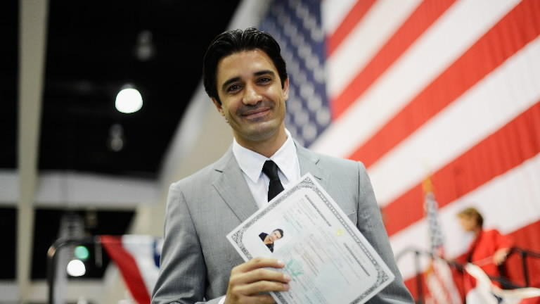 new American holding certificate and proud of benefits of us citizenship