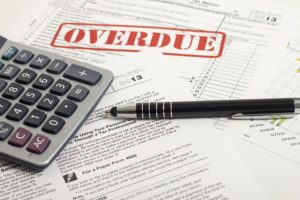 Filing N-400 with Overdue Taxes
