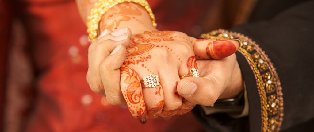 Indian couple holds hands, represents sponsor a fiancé for a K-1 visa