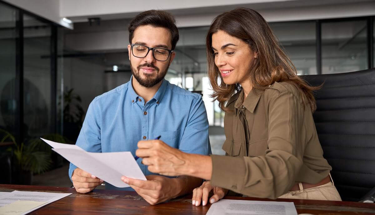 Man and woman review their adjustment of status interview checklist