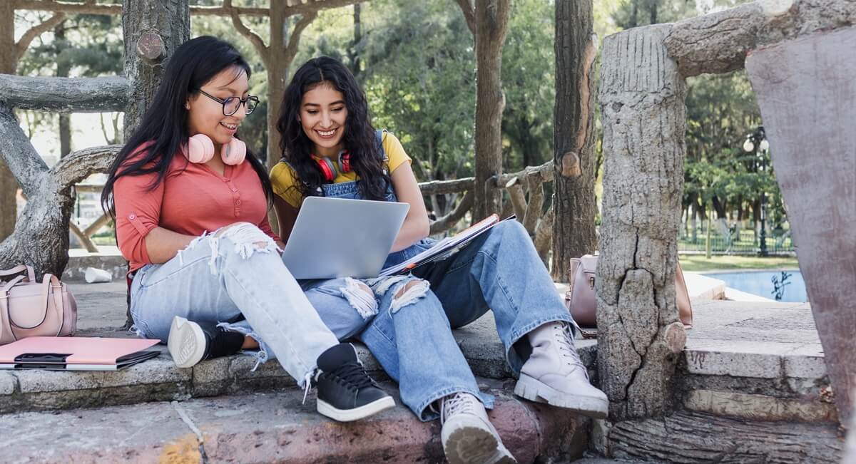 Two undocumented students prepare an assignment